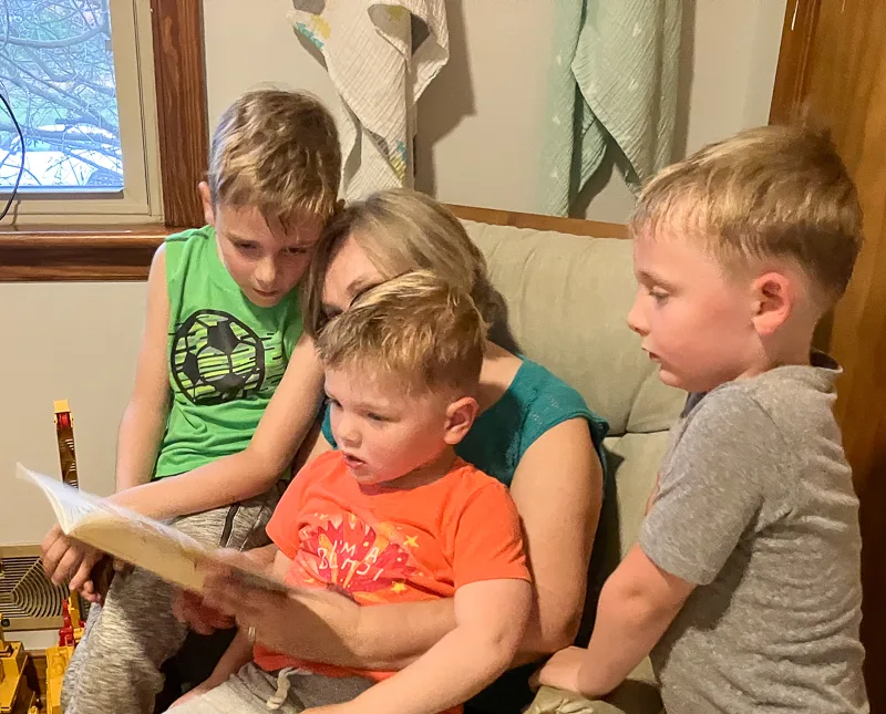 Grandma Reading Books to boys