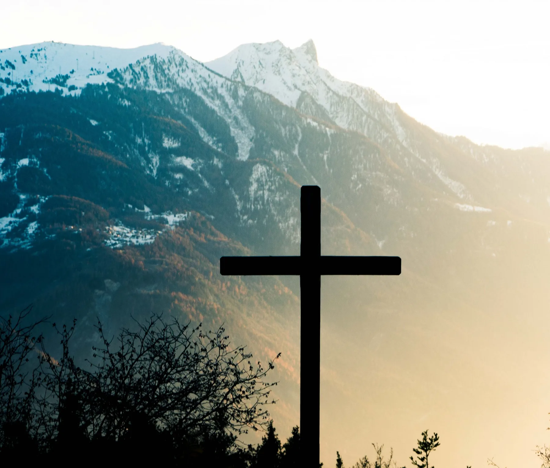 cross with mountain