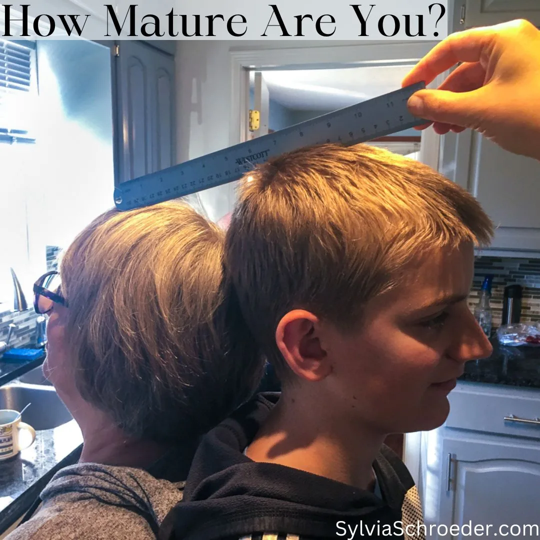 Grandma and Grandson measuring height.
